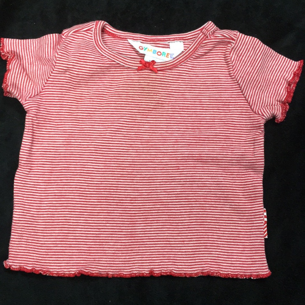 A little girls red and white striped shirt